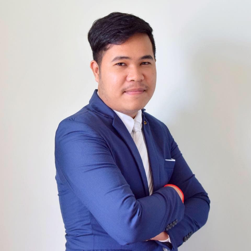 Professional portrait of a male tech executive in a modern studio setting with warm cinematic lighting and dark background